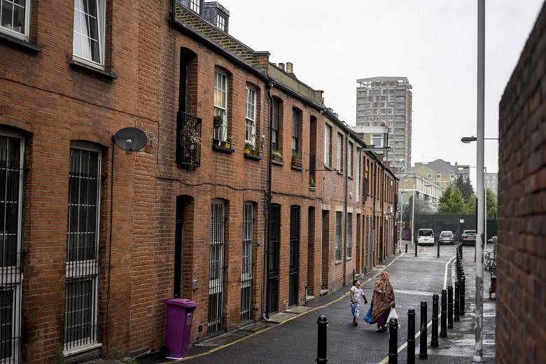 A street in the Bethnal Green neighbourhood of East London, home to a conservative Muslim community, where several teenage girls were drawn to Islamic State in Iraq and Syria militants. Britain's programme encouraging fellow citizens to identify pote