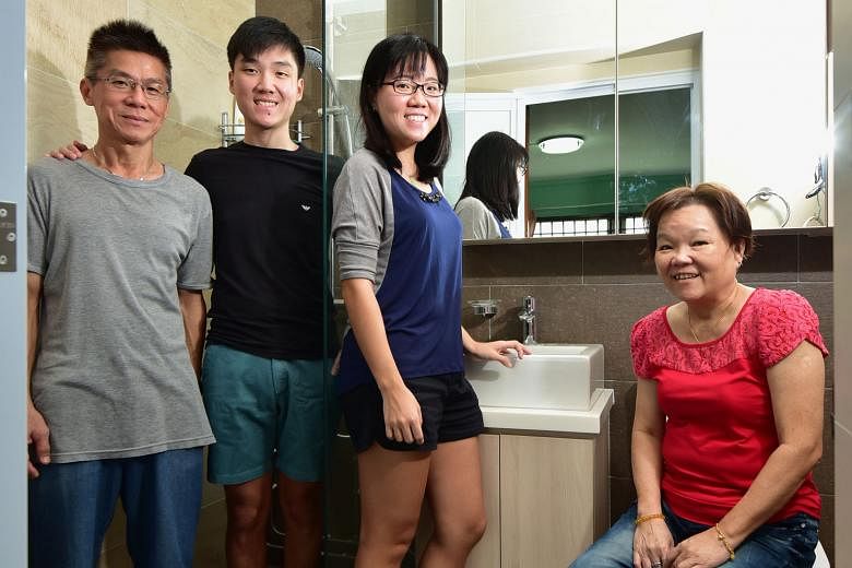 Miss Jasmine See (third from left) with her dad Victor, brother Nicholas and mum Joyce in their renovated, "hotel-concept" bathroom.