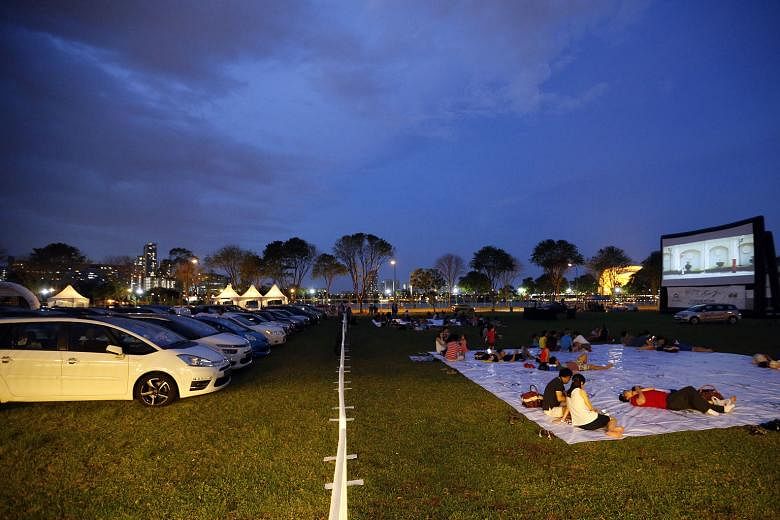 Viewers at a drive-in movie event organised in Tanjong Rhu yesterday evening by Citroen and Cycle and Carriage to celebrate 10 years of partnership ahead of Valentine's Day today. A separate picnic area was set aside for those who did not drive in. A