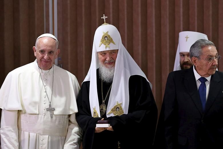 (From far left) Pope Francis, Patriarch Kirill and Cuban President Raul Castro at Havana's international airport on Friday.