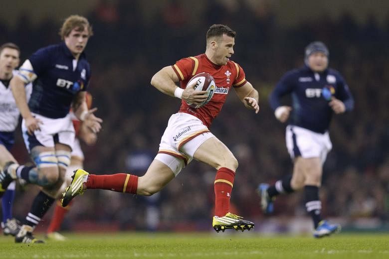 Gareth Davies of Wales runs in to score his team's first try. Scotland's players felt the try should have been ruled out for offside, but the referee awarded it and the Scots fell to their ninth straight loss against the Welsh.