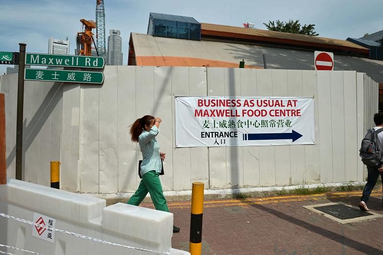 Hawkers at Maxwell Food Centre say business started to drop when hoardings went up in the middle of 2014, and worsened when a nearby carpark closed last March because of ongoing MRT construction work. They appealed to both NEA and URA for help.