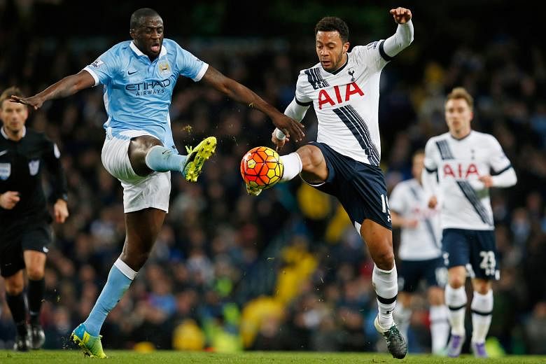 Manchester City's Yaya Toure (left) and Tottenham's Mousa Dembele in action on Sunday.