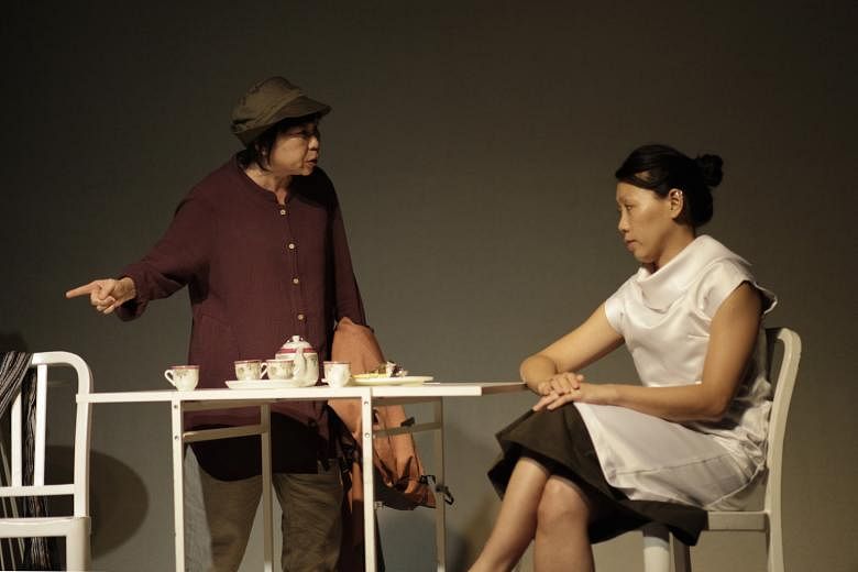Goh Guat Kian (far left), who plays multiple characters across two eras, and Koh Wan Ching during rehearsals for Manifesto.