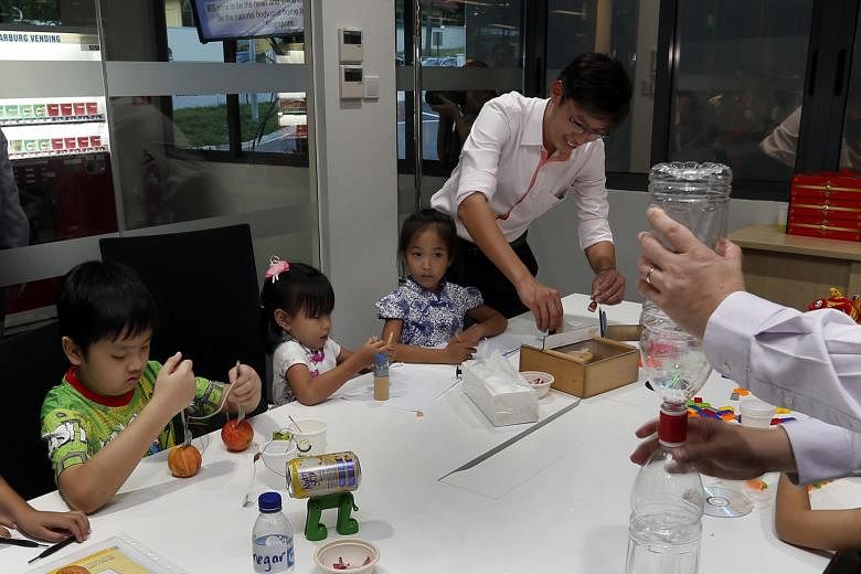 Children learning about science at yesterday's opening of a new building at The Institution of Engineers, Singapore.