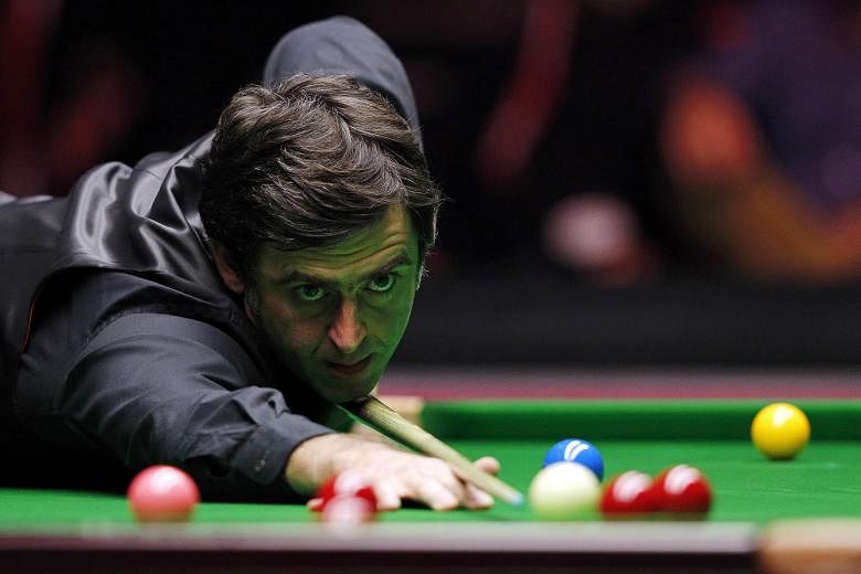 England's Ronnie O'Sullivan plays a shot during the Masters Snooker final last month. On Monday, the five-time world champion was on the brink of the 14th maximum break of his career, but opted against it because he said the £10,000 (S$20,200) prize