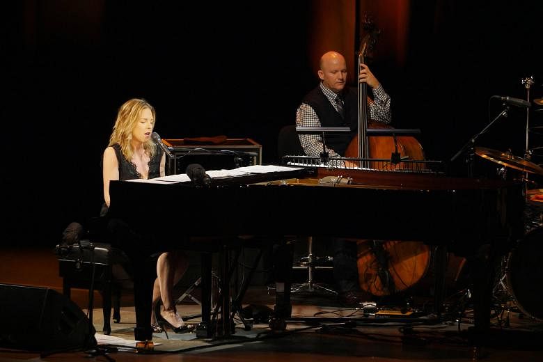 Diana Krall shows great synergy with her musicians, including bassist Dennis Crouch.