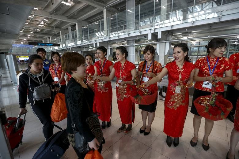 Visitors from China arriving at Bangkok's Suvarnabhumi Airport. Thailand is under pressure to improve its aviation standards after the US Federal Aviation Administration downgraded its safety ratings in December last year.