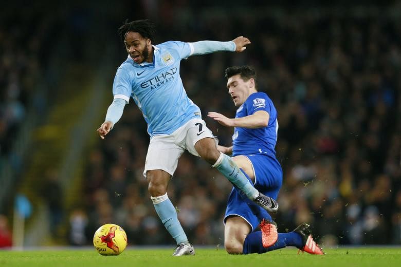 Manchester City's Raheem Sterling (left) in action against Everton's Gareth Barry in their League Cup semi-final. He will face Liverpool in the final today and Pellegrini says that although it is never easy to play against a former club, Sterling is 