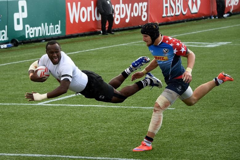 Pio Tuwai diving for a try as Garrett Bender of the US fails to stop him in their semi-final. Fiji beat Australia in the Las Vegas final.