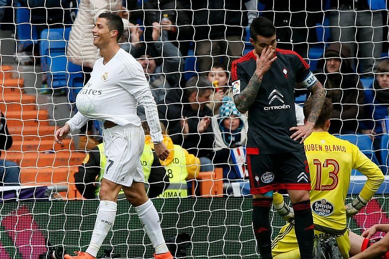 Real Madrid's Cristiano Ronaldo (left) in a jolly mood after scoring the third of four goals against Celta Vigo in the 7-1 La Liga win on Saturday. His team will be looking to defeat Roma today to book their place in the Champions League quarter-fina