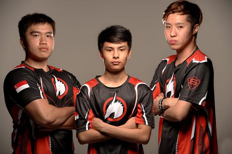 Singaporeans (from left) Joshua Lim, Juan Rodriguez and Amos Goh are members of local Halo team Skyfire. Together with Filipino Franciso Adriano, they will compete in this year's Halo World Championship in California. Mr Rodriguez is team captain and