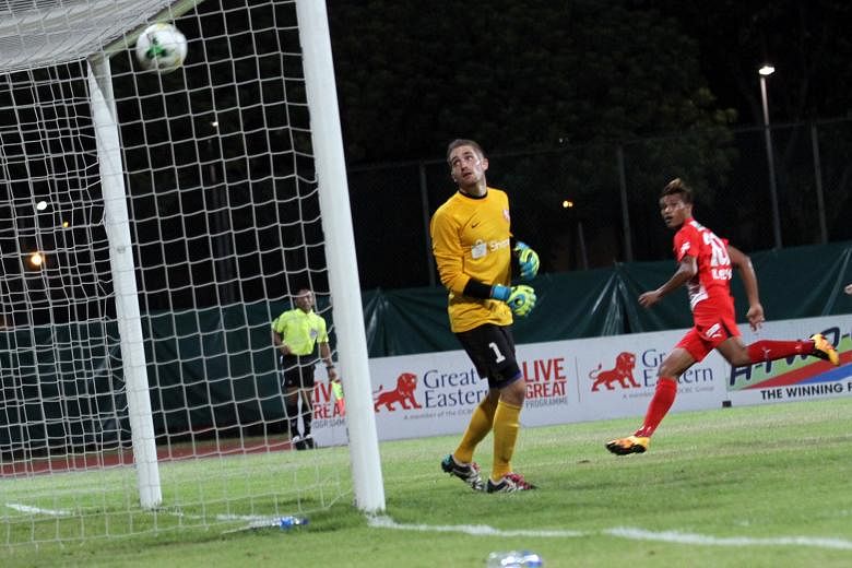 Young Lions goalkeeper Benjamin Bertrand looks on helplessly after Khairul Nizam's header loops over him into the net. After six games, the Young Lions are bottom of the table.