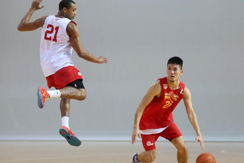 Singapore Slingers guard Ng Hanbin dribbles past his team-mate Xavier Alexander during a training session. The Slingers will be hoping home-court advantage will give them the edge over the Dragons as the Asean Basketball League finals series comes to