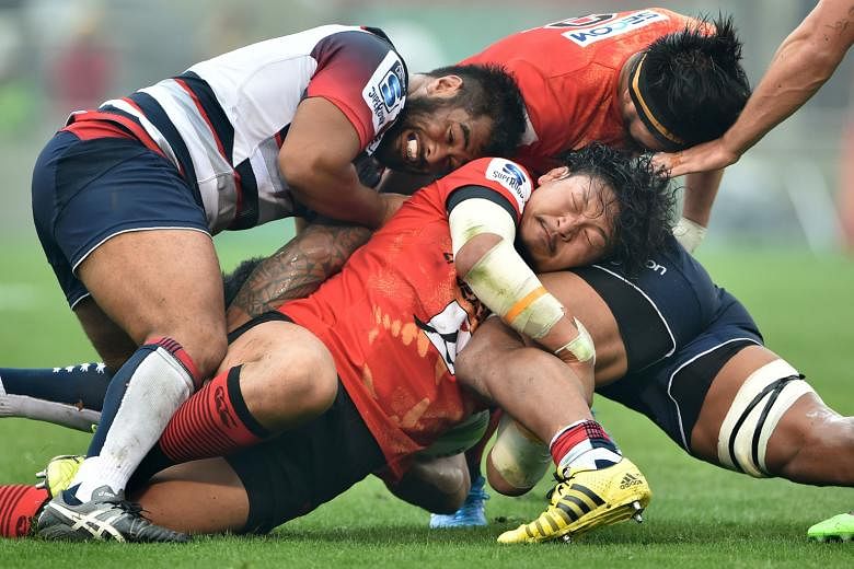 Sunwolves prop Keita Inagaki (centre, in red) during Saturday's 9-35 Super Rugby loss to Australia's Rebels in Tokyo. The Sunwolves, who have lost all their three games so far in what is proving to be a trying debut season, are back at the Singapore 
