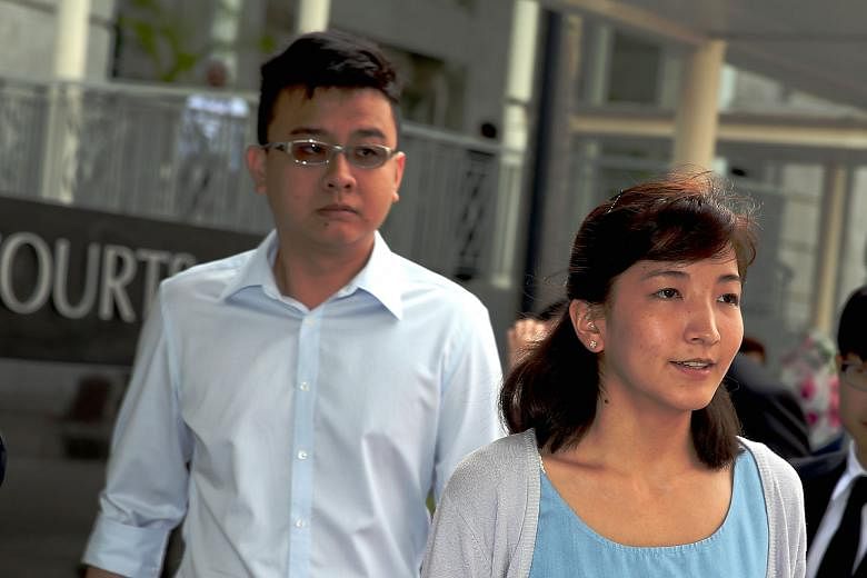 Takagi arriving at the court yesterday with her husband, Yang. Takagi, who is eight weeks pregnant, apologised to Singaporeans for the harm the articles had caused.