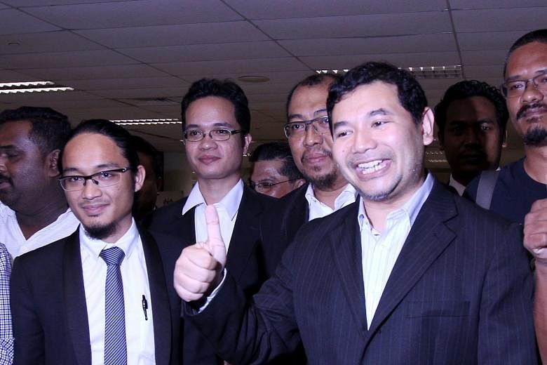 Mr Rafizi (right) was charged under the Official Secrets Act with unlawful possession of the Auditor-General's report on 1MDB and leaking a page of that document to the media on March 28.
