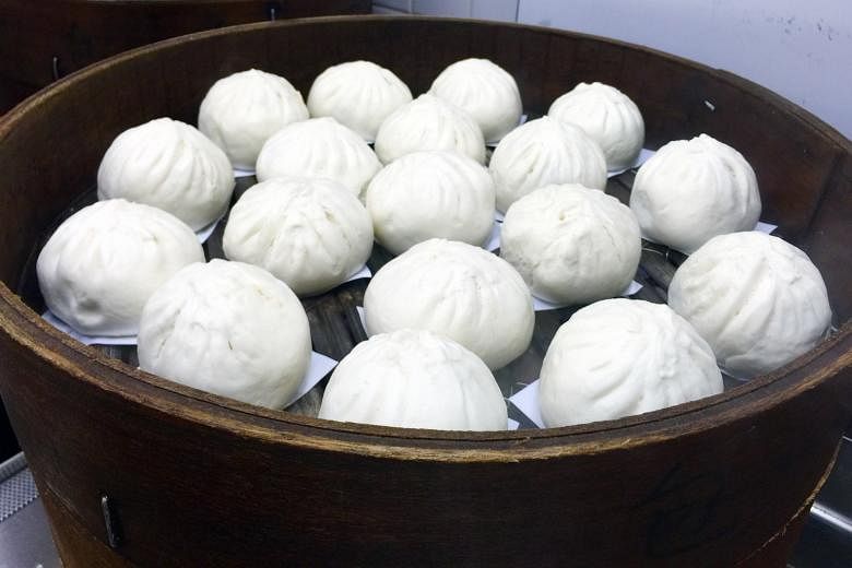 The big pau is filled with a quarter hard-boiled egg and slices of pork stir-fried with onions and bangkwang.