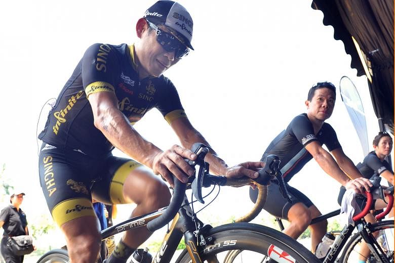 National cyclist Vincent Ang (left) putting a different spin on the sport yesterday as he joined over 300 cyclists at the F1 Pit Building to generate electricity in a 24-hour cyclothon which kicked off at noon. The cyclothon is part of the National G