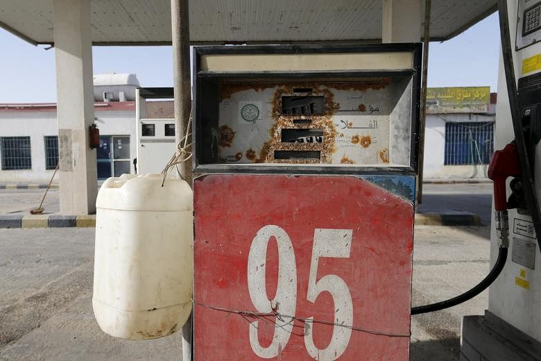 A fuel pump near Salwa village in Saudi Arabia. Like other major oil producers, Saudi Arabia has been hit by the continued slump in oil prices.
