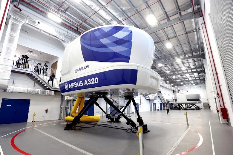 A flight simulator at the Airbus Asia Training Centre which has 15 instructors, mainly former SIA pilots, and there are plans to hire up to 50 by 2019. To date, 17 airlines have signed up for courses at the facility.