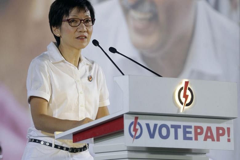Ms Fu (left) and Madam Halimah (above), speaking at the PAP rally at Bukit Gombak Stadium, say Mr Murali's 16-year track record of volunteer work in Bukit Batok shows that he is a sincere, humble and committed man.