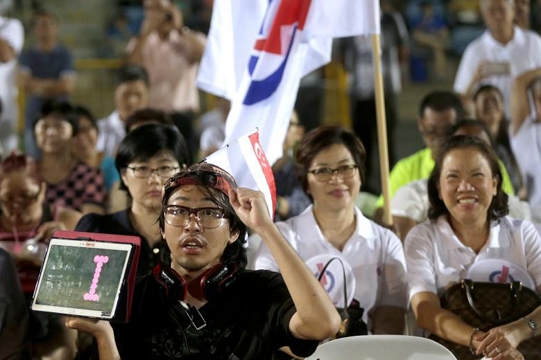 PAP supporters attending a rally at Bukit Gombak Stadium last Friday. Mr Murali has served in Bukit Batok for 16 years and is a familiar face in the area. This connection to the grassroots could give him a lift.