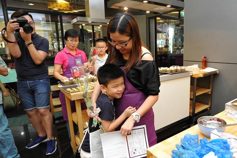 Ong Yehing giving his mother, Ms Lim Ting, a hug yesterday during a Mother's Day event organised by the Haemophilia Society of Singapore. Yehing is one of some 250 people in Singapore who suffer from haemophilia.