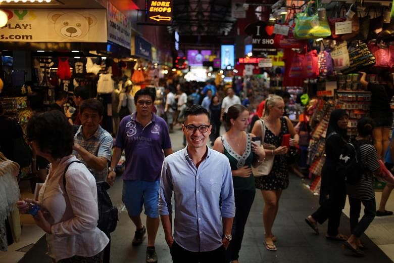 Bugis Street Online chief executive Ivan Loh (centre) believes retail today is about how the brick and mortar shops and e-commerce can complement each other.