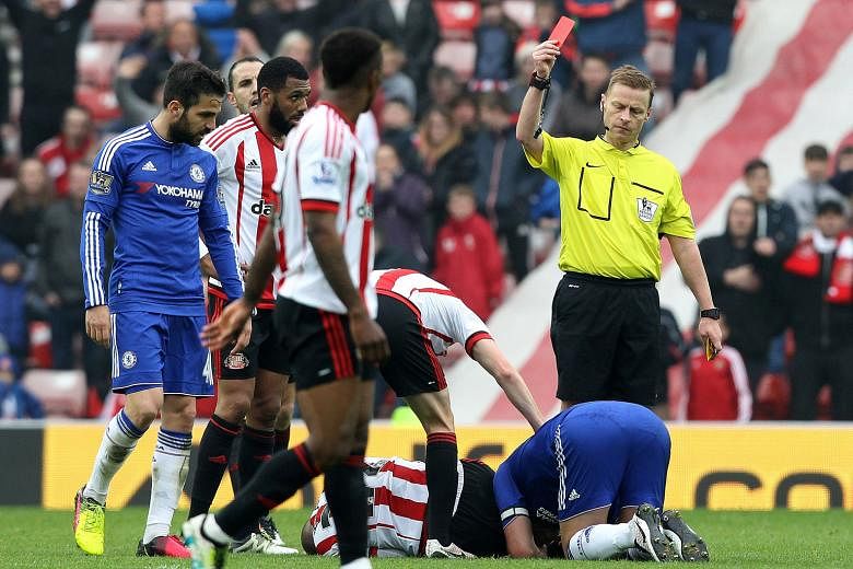 Referee Mike Jones dismisses Chelsea's John Terry after his challenge on Sunderland's Wahbi Khazri. The Blues skipper will miss the last two games of the season, and possibly his Chelsea career.