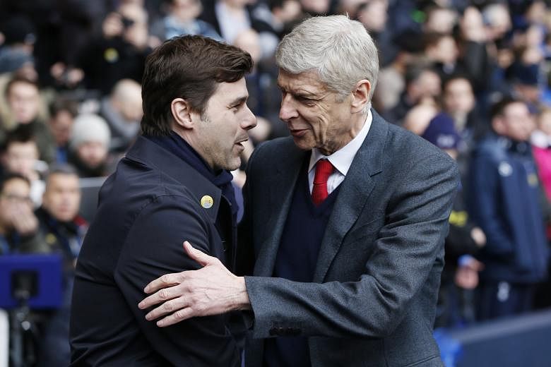 Arsenal manager Arsene Wenger (right) and Tottenham manager Mauricio Pochettino before their teams met on March 5