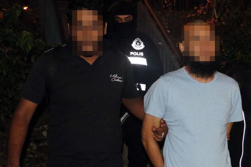 Eight of the suspects (above, and right) are linked to channelling funds to ISIS and the Abu Sayyaf militant group in the southern Philippines.