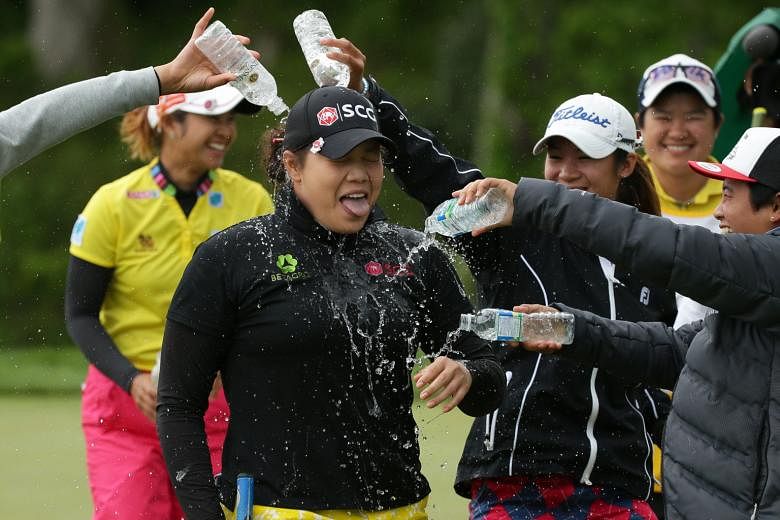 Ariya Jutanugarn is doused with water after winning the Kingsmill Championship. She became the first Thai to win on the LPGA Tour the previous week following her win in Alabama.