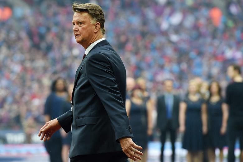 Manchester United manager Louis van Gaal walks onto the pitch before the FA Cup final on Saturday. The 2-1 victory against Crystal Palace did nothing to rescue his long-term prospects at the historic club.