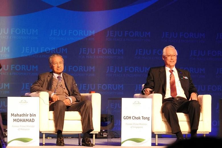 ESM Goh and former Malaysian prime minister Mahathir Mohamad at the annual Jeju Forum on the South Korean resort island yesterday. Mr Goh delivered the keynote speech.