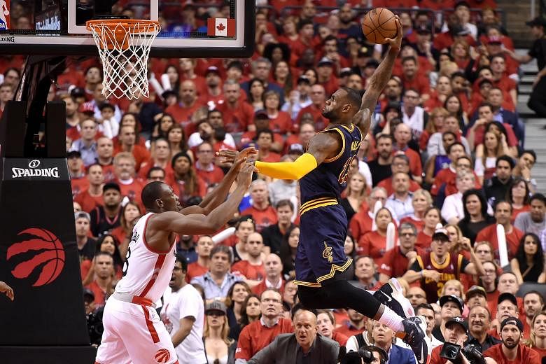 LeBron James going for a dunk in the second quarter of the Cavaliers' Game 6 win over the Raptors in the Eastern Conference finals. The Cavs star scored 33 points to lead his team to their second straight NBA Finals appearance.