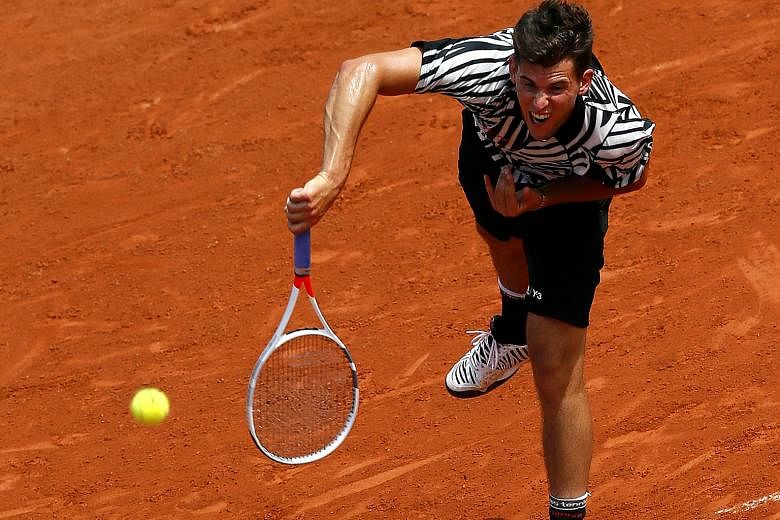 Austria's Dominic Thiem in action yesterday against Alexander Zverev of Germany. Thiem won their third-round match 6-7 (4-7), 6-3, 6-3, 6-3. Shortly after, rain brought all other matches to a halt.