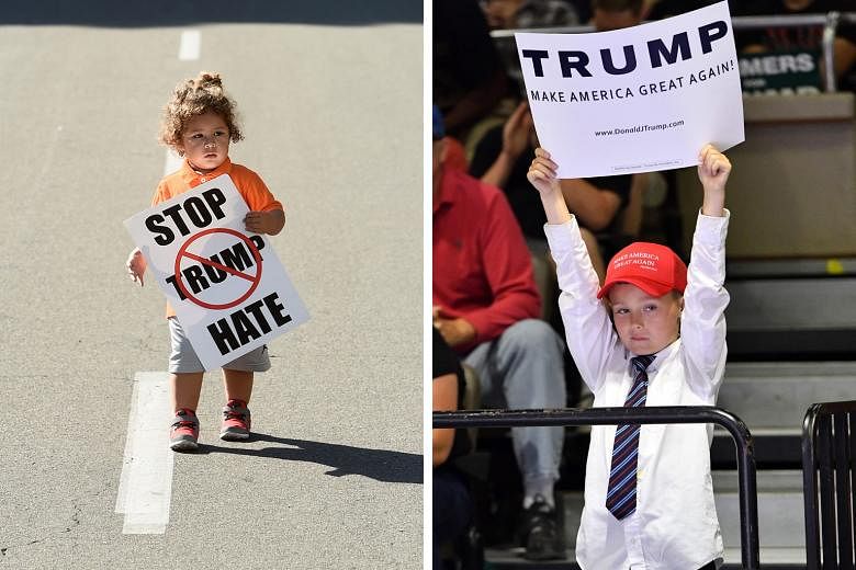 An unidentified boy with a pro-Trump sign at a rally for the candidate in Fresno last week. Mr Trump has pitched much of his election rhetoric at working-class white voters who welcome his hard line on immigration and trade. Two-year-old Noah Gomez w