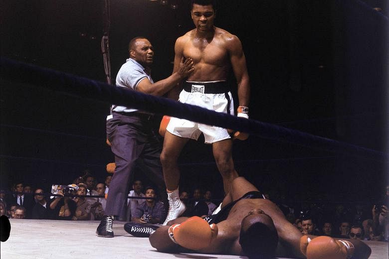 May 25, 1965: Ali standing over a fallen Sonny Liston in the second of two fights between the two. Liston was world heavyweight champion when they first fought in February 1964. Liston lost that fight. Ali went on to clinch the world heavyweight titl