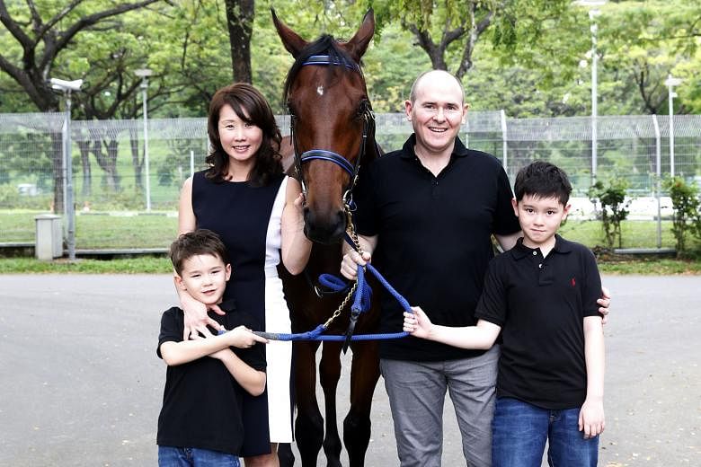 Mr Mitchell with his wife Evelyn, sons Callum, seven, and Leeum, nine, and horse Whose Else's. Mr Mitchell enjoys the thrill that comes with horse racing, but warns that it is a lot less stable than other investments such as art or property.