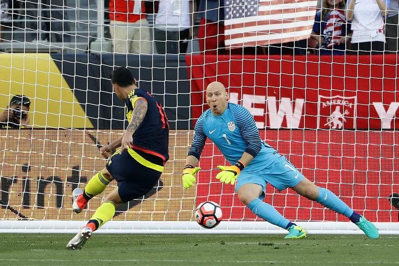 Colombia skipper James Rodriguez sending US goalkeeper Brad Guzan the wrong way from the spot to seal a 2-0 win for his side and pile on the pressure for US coach Jurgen Klinsmann.