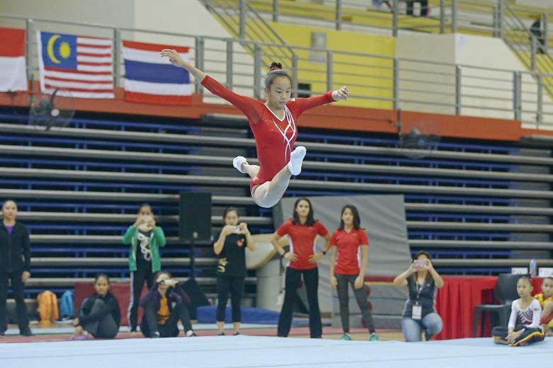 Tan Sze En executing her floor routine at the Singapore Open. She scored 13.600 points to win gold.