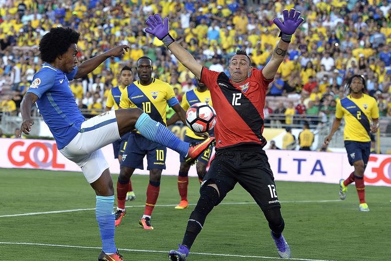 Brazil midfielder Willian shooting against Ecuador goalkeeper Esteban Dreer in their Copa America Group B opener. The Selecao had nine attempts at goal, with two finding the target. Despite 70 per cent possession, the five-time world champions failed