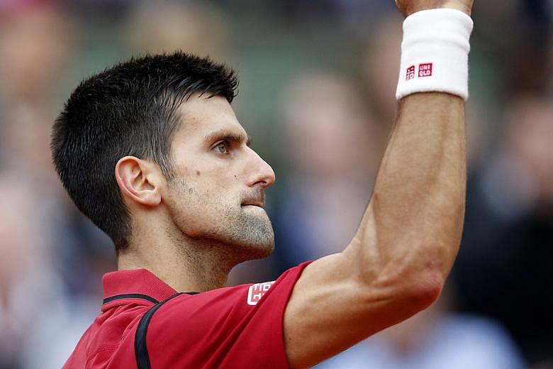 Novak Djokovic after winning a point during the French Open final against Andy Murray. The four-set victory allowed the Serb to stretch his winning record over the Scot to 24-10 overall and 8-2 in Grand Slams. For Murray, it was his eighth loss in 10