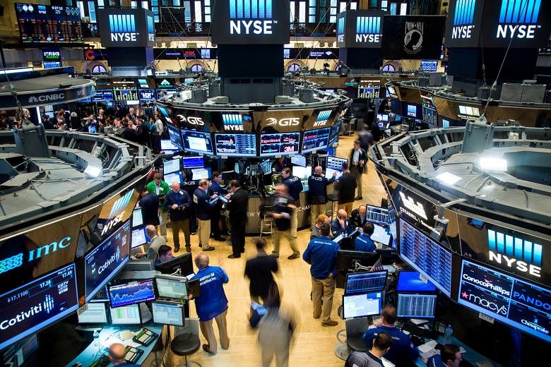 The trading floor of the New York Stock Exchange. US markets, which tumbled at the start of the year, have recouped their losses, with the Dow Jones Industrial Average up 2.08 per cent for 2016 as at the end of last month.