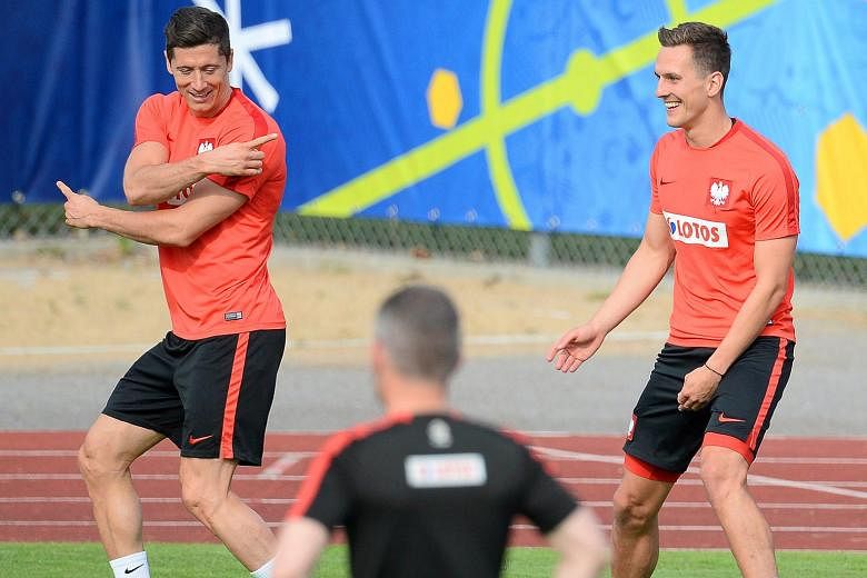 Polish forwards Robert Lewandowski (left) and Arkadiusz Milik will be relied upon to provide the firepower against their more heralded opponents at Euro 2016. The duo combined with devastating effect in qualifying, accounting for 19 of Poland's 33 go