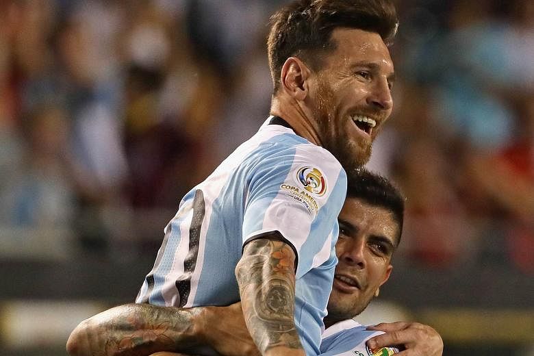 Lionel Messi gets a lift from team-mate Ever Banega after scoring from a free kick to put Argentina 3-0 up against Panama. The 5-0 rout assured them a spot in the quarter-finals and they are likely to top Group D.
