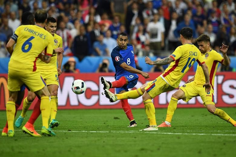 With the clock ticking down, Dimitri Payet (centre) scores the dramatic winner in France's 2-1 victory in the Group A encounter against Romania at Stade de France on Friday. The host nation's Man of the Match said later: "There had been a lot of stre