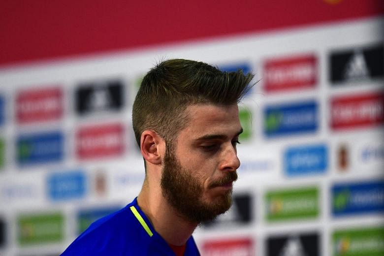 A downcast Spain goalkeeper David de Gea leaving a press conference, where he angrily denounced the claims as "a lie". News reports allege he tried to arrange a prostitute for five United team-mates. Spain coach Vicente del Bosque has not decided who