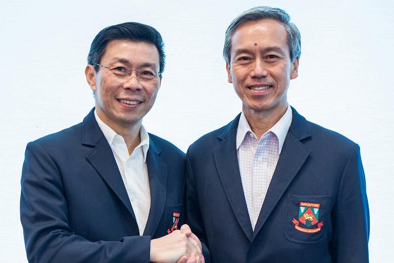 Lee Yi Shyan (left) handing over the SBA's reins to Tan Kian Chew. The latter is no stranger, having held two other posts before, and is set to keep his predecessor's policy of grooming youth rather than importing talent.